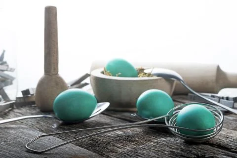 Teal easter eggs with spoons Stock Photos