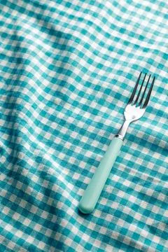 Teal Fork On Turquoise Gingham Check Tablecloth For Picnic And Vintage Kitc.. Stock Photos