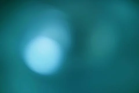 A Teal Gradient Bokeh Background with Light and Shadow Effects Stock Photos