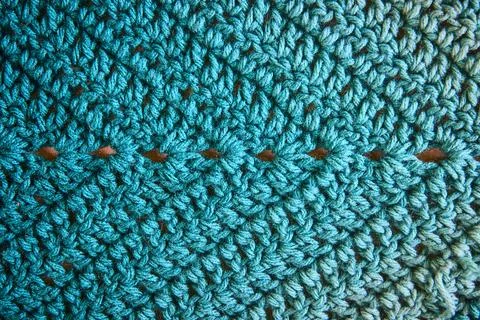 Teal Knitted Yarn Diamond Pattern Close-Up Eye-Level View 스톡 사진