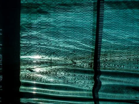 Teal Mesh Fabric Texture Reflected in Water with Soft Light Highlights, Wov.. 스톡 사진