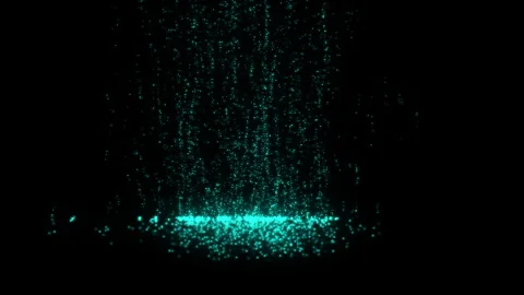 Teal particles cascading, settling on a dark surface Stock Footage 291173519