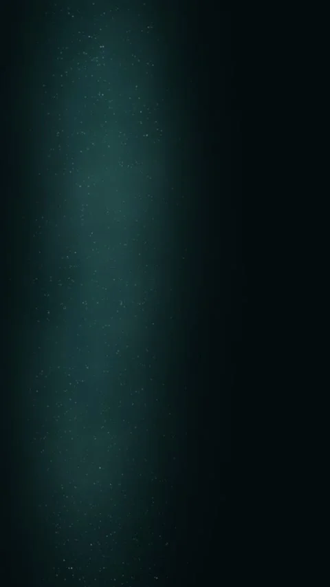 Teal plume ascends and diffuses, illuminating a dark field Video stock 330059968