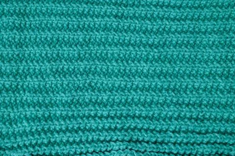 Teal wool knitting pattern showing textured fabric background Stock Photos