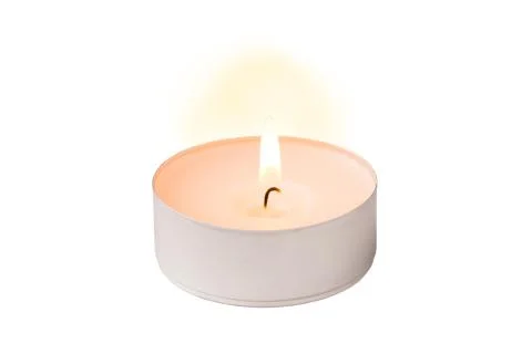 Tealight burning on white background Stock Photos