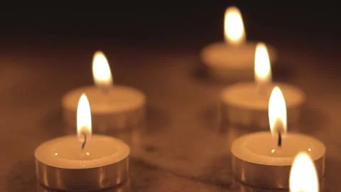 Tealight candles in the dark.  Stock Footage 202274213