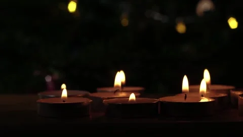 Tealight candles flickering with bokeh background Stock Footage 260329382