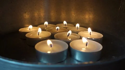 Tealights burn in a pot, an alternative source of heat Stock Footage 171592815