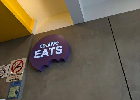 Tealive eats unique sign displayed on the wall of the shop Stock Photos