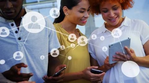 Team of 3 tapping tablet and phones, causing growing node graphic over devices, Video stock 333901178