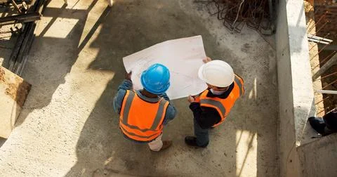 Team, above or engineer with blueprint for planning, development review or Stock Photos
