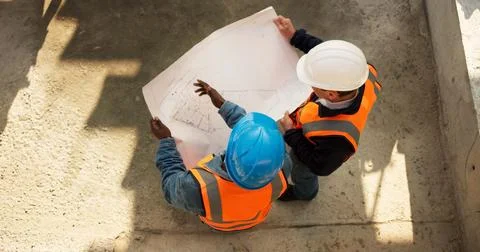 Team, above or engineer at construction site with blueprint, development review Stock Photos