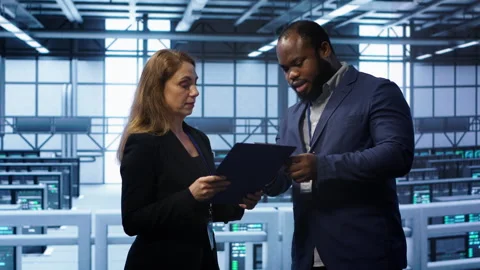 Team of admin in server hub checking recovery plan, monitoring data center Stock Footage 277655165
