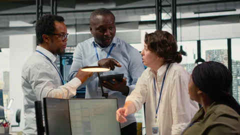 Team of admins brainstorm in AI startup office to train predictive models Stock Footage 323407704