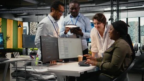 Team of admins brainstorm in AI startup office to train predictive models Stock Photos