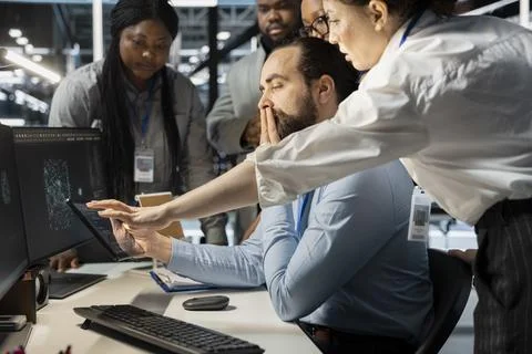 Team of admins working together in server hub, analyzing rigs data 스톡 사진