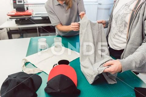 Team in advertising agency discussing which items to use in promotion Stock Photos