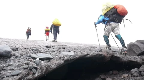 Team of Alpine Climbers walking through glacier Stock Footage 43248855