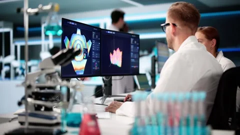 Team Of Analysts Using 3D Software For Research Stock Footage 311730209