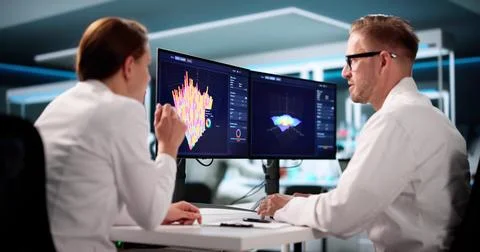 Team Of Analysts Using 3D Software For Research In A Lab. Stock Photos