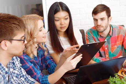 Team of app developers discussing the project Stock Photos