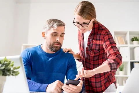 Team of app developers testing new application Stock Photos