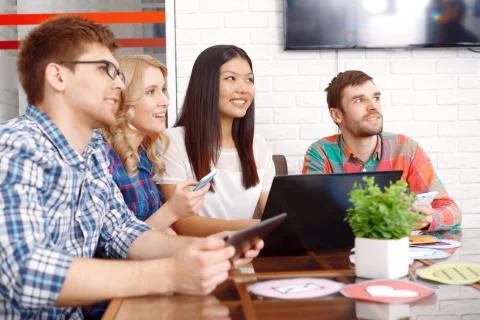Team of app developers working together Stock Photos