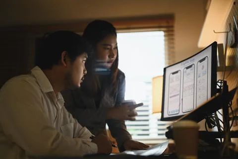 Team of application developers working on new website wireframe at creative Stock Photos