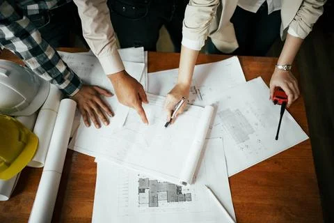 Team of architect and engineer working and discussing about new project. Stock Photos
