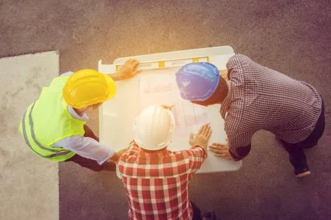 Team of Architect engineer planning group project partners meeting at site 写真素材