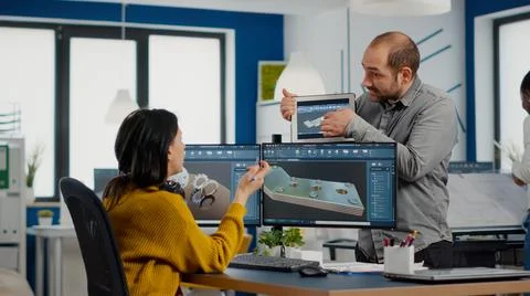 Team of architects and engineers working on building prototype project Stock Photos