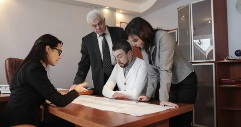 The team of architects led by the old director. Stock Footage 86388972