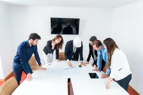 Team of architects presenting construction project. Engineers and Architects  Stock Photos
