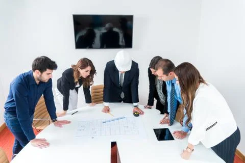 Team of architects presenting construction project. Engineers and Architects  Stock Photos
