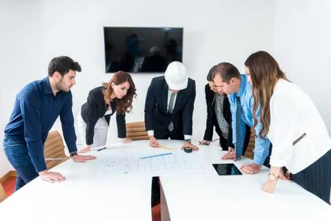 Team of architects presenting construction project. Engineers and Architects  Stock Photos