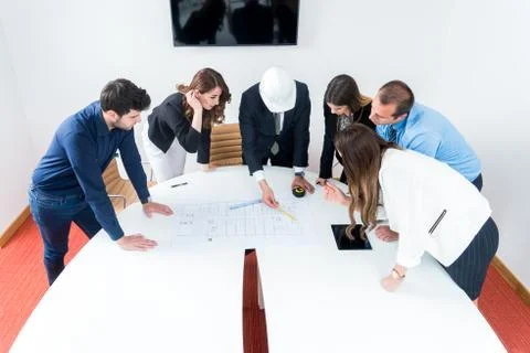 Team of architects presenting construction project. Engineers and Architects  Stock Photos
