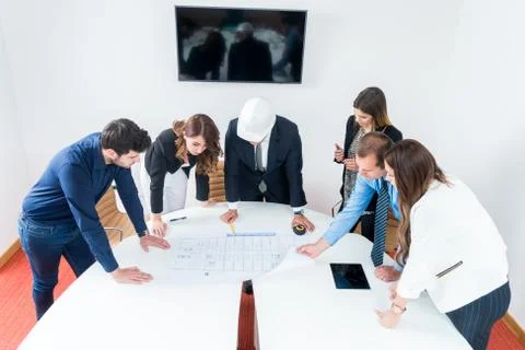 Team of architects presenting construction project. Engineers and Architects  Stock Photos