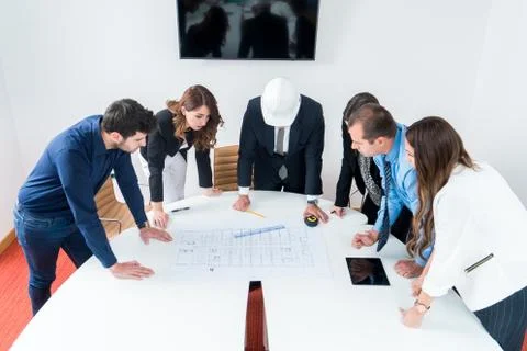 Team of architects presenting construction project. Engineers and Architects  Stock Photos