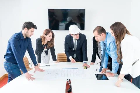 Team of architects presenting construction project. Engineers and Architects  Stock Photos