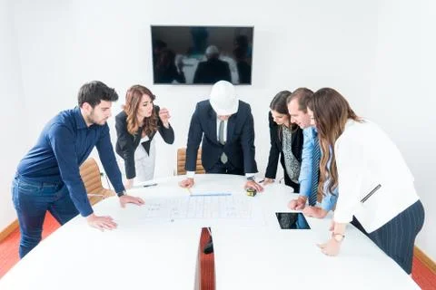 Team of architects presenting construction project. Engineers and Architects  Stock Photos