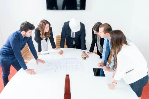 Team of architects presenting construction project. Engineers and Architects  Stock Photos