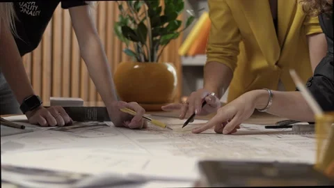 Team of architects in the process of discussing the design plan Stock Footage 223103065