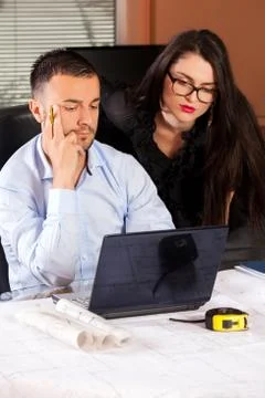 Team of architects working on construction plan in the office  Stock Photos