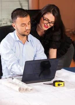 Team of architects working on construction plan in the office  Stock Photos
