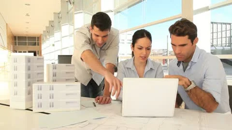 Team of architects working on project Stock Footage 14828079