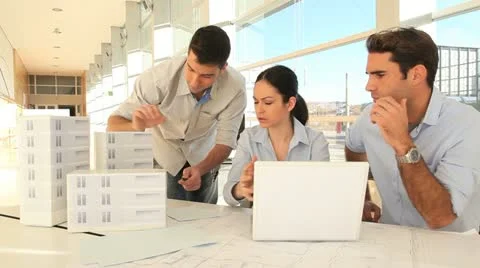 Team of architects working on project Stock Footage 14828085