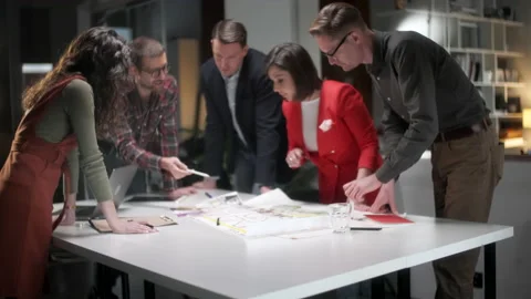 Team Of Architects Working On Project Paper Blueprint. Group Of Modern Business Stock Footage 132884202