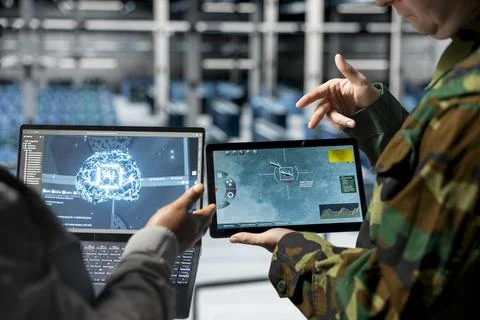 Team of army workers in data center using predictive AI tech on devices Stock Photos
