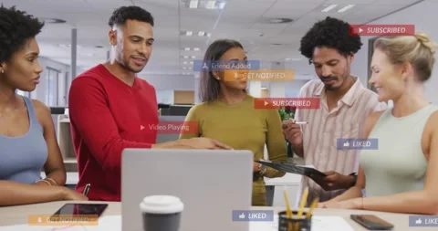Team around devices, lead swiping pad and pointing tablet, labels popping then Stock Footage 330258376