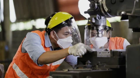 Team Asian Machine engineer wearing face shield work active in factory Industry. Stock Footage 159222762